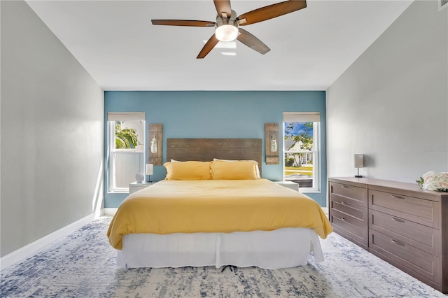 501 Dunoon St, Ocoee, FL 34761 - bedroom featuring multiple windows, baseboards, a ceiling fan, and carpet floors