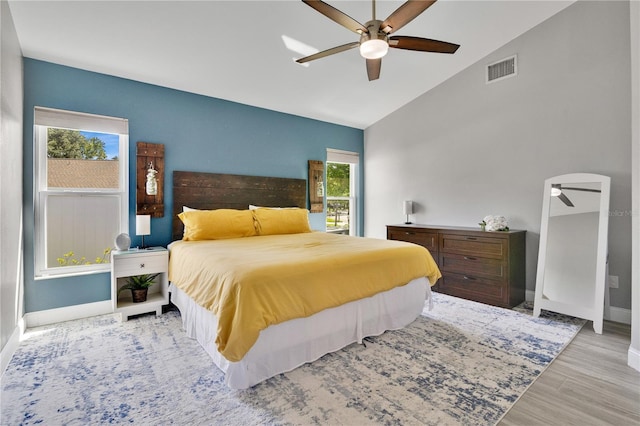 501 Dunoon St, Ocoee, FL 34761 - bedroom featuring baseboards, lofted ceiling, wood finished floors, and a ceiling fan