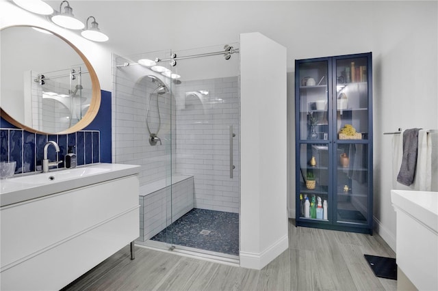 501 Dunoon St, Ocoee, FL 34761 - full bath featuring vanity, a shower stall, baseboards, and wood finished floors
