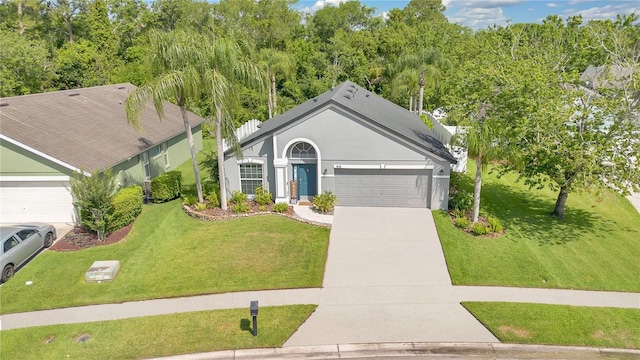 501 Dunoon St, Ocoee, FL 34761 - ranch-style house with an attached garage, a front yard, concrete driveway, and stucco siding