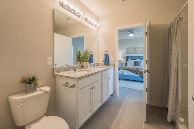 246 Cheshire Ct, Kissimmee, FL 34758 - full bath featuring ensuite bath, double vanity, toilet, tile patterned flooring, and a shower with shower curtain