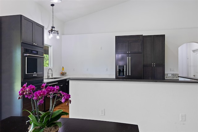 4730 Cypress Creek Ranch Rd, Saint Cloud, FL 34771 - kitchen with built in refrigerator, oven, a sink, hanging light fixtures, and arched walkways