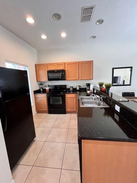 3014 Red Ginger Rd, Kissimmee, FL 34747 - kitchen featuring black appliances, a sink, recessed lighting, a peninsula, and light tile patterned floors