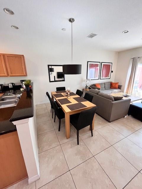3014 Red Ginger Rd, Kissimmee, FL 34747 - dining space with light tile patterned flooring and recessed lighting