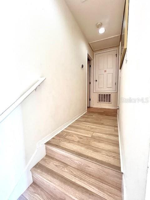 3014 Red Ginger Rd, Kissimmee, FL 34747 - stairs with wood finished floors and baseboards