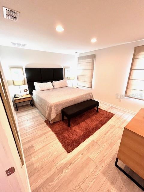 3014 Red Ginger Rd, Kissimmee, FL 34747 - bedroom with wood finished floors and recessed lighting