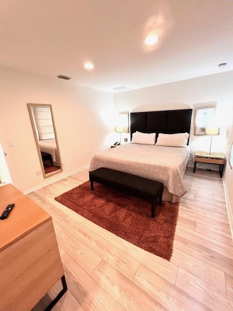3014 Red Ginger Rd, Kissimmee, FL 34747 - bedroom featuring light wood-type flooring, recessed lighting, and baseboards