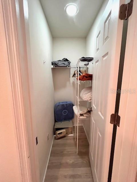 3014 Red Ginger Rd, Kissimmee, FL 34747 - walk in closet featuring wood finished floors