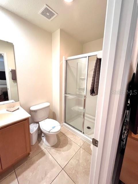 3014 Red Ginger Rd, Kissimmee, FL 34747 - bathroom with vanity, a stall shower, toilet, and tile patterned flooring