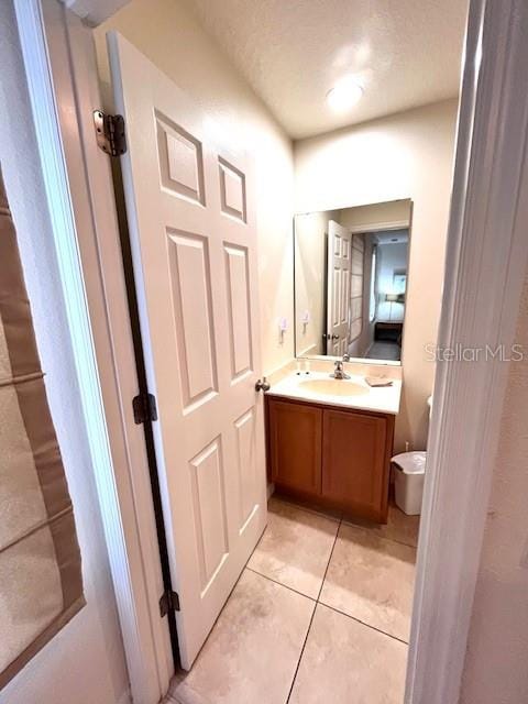 3014 Red Ginger Rd, Kissimmee, FL 34747 - half bath featuring vanity, tile patterned flooring, and toilet