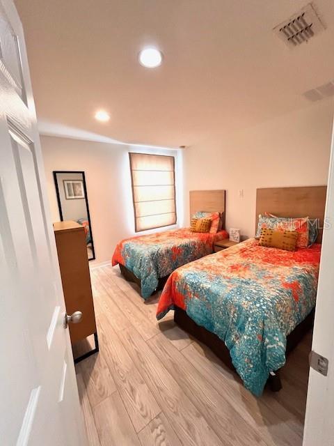 3014 Red Ginger Rd, Kissimmee, FL 34747 - bedroom with wood finished floors and recessed lighting