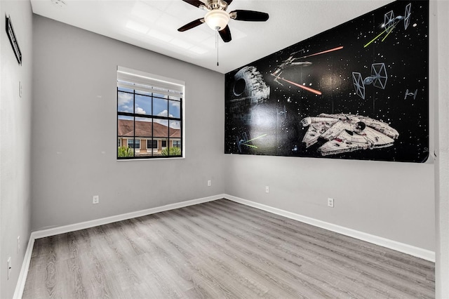 1628 Portofino Meadows Blvd, Orlando, FL 32824 - unfurnished room featuring wood finished floors, ceiling fan, and baseboards