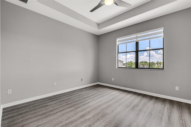 1628 Portofino Meadows Blvd, Orlando, FL 32824 - spare room featuring dark wood-type flooring, a ceiling fan, and baseboards