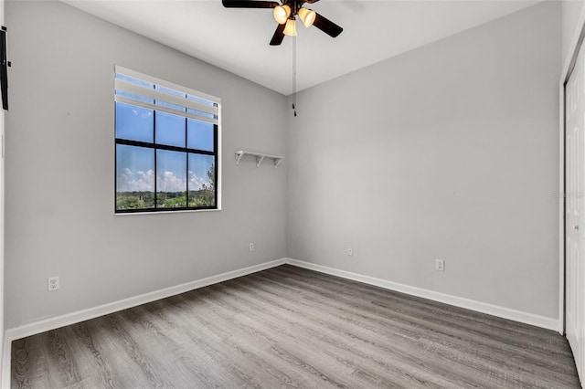 1628 Portofino Meadows Blvd, Orlando, FL 32824 - empty room featuring ceiling fan, wood finished floors, and baseboards