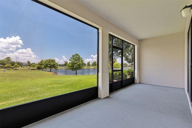 1628 Portofino Meadows Blvd, Orlando, FL 32824 - unfurnished sunroom with a water view and concrete flooring
