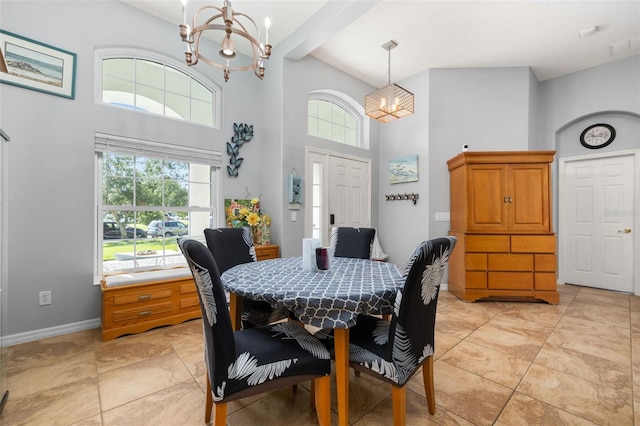 1760 Boat Launch Rd, Kissimmee, FL 34746 - dining area with a chandelier, a towering ceiling, and baseboards