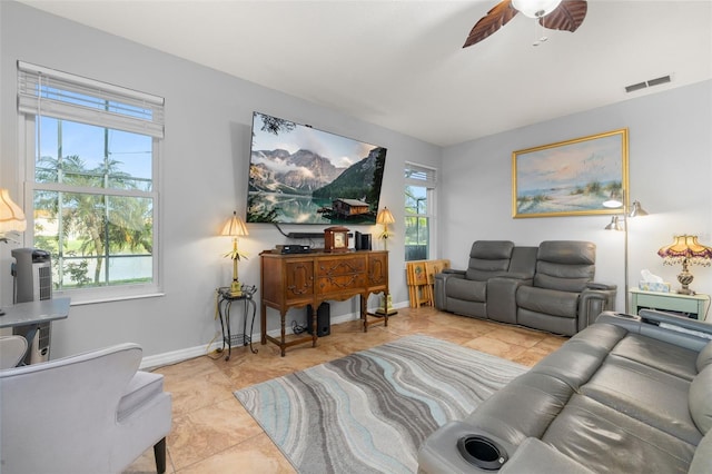 1760 Boat Launch Rd, Kissimmee, FL 34746 - living room with ceiling fan, tile patterned floors, and baseboards