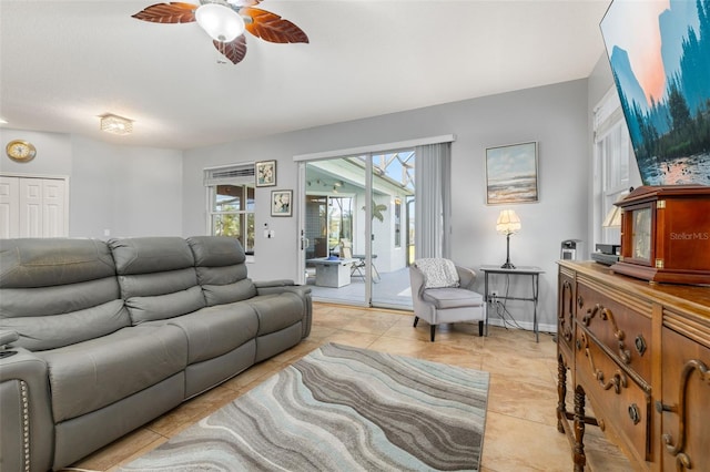 1760 Boat Launch Rd, Kissimmee, FL 34746 - living room with a ceiling fan, light tile patterned flooring, and baseboards