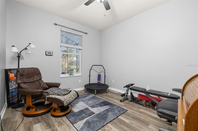1760 Boat Launch Rd, Kissimmee, FL 34746 - living area with wood finished floors, baseboards, and ceiling fan