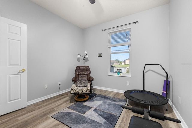 1760 Boat Launch Rd, Kissimmee, FL 34746 - living area with wood finished floors, baseboards, and ceiling fan