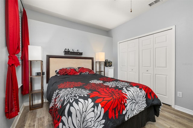 1760 Boat Launch Rd, Kissimmee, FL 34746 - bedroom featuring wood finished floors, baseboards, and a closet