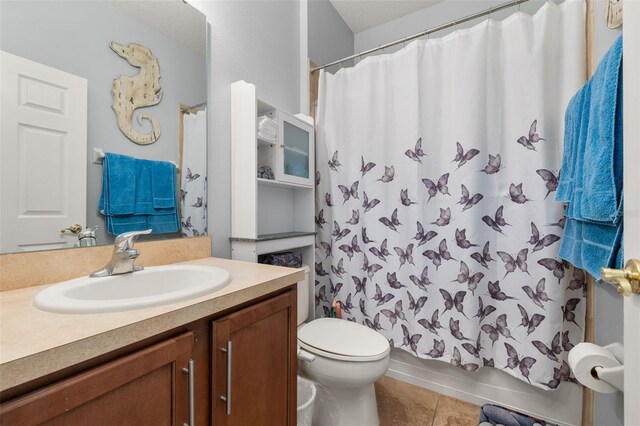 1760 Boat Launch Rd, Kissimmee, FL 34746 - bathroom with vanity, tile patterned floors, and toilet