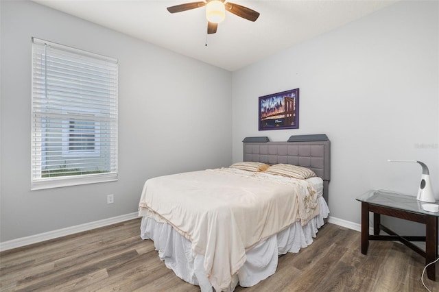 1760 Boat Launch Rd, Kissimmee, FL 34746 - bedroom featuring wood finished floors, baseboards, and a ceiling fan