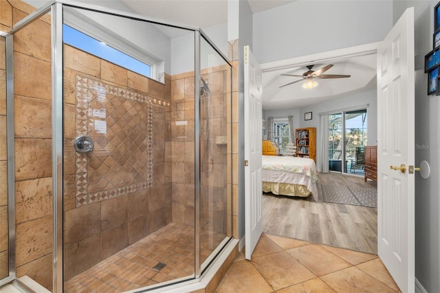 1760 Boat Launch Rd, Kissimmee, FL 34746 - ensuite bathroom with ceiling fan, a stall shower, and tile patterned flooring
