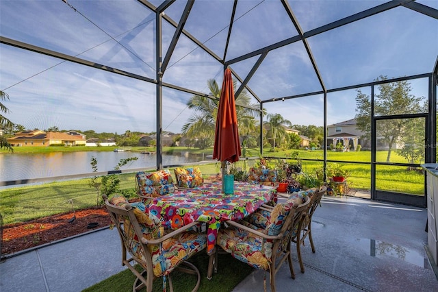 1760 Boat Launch Rd, Kissimmee, FL 34746 - view of patio / terrace with a water view, outdoor dining area, glass enclosure, and a residential view