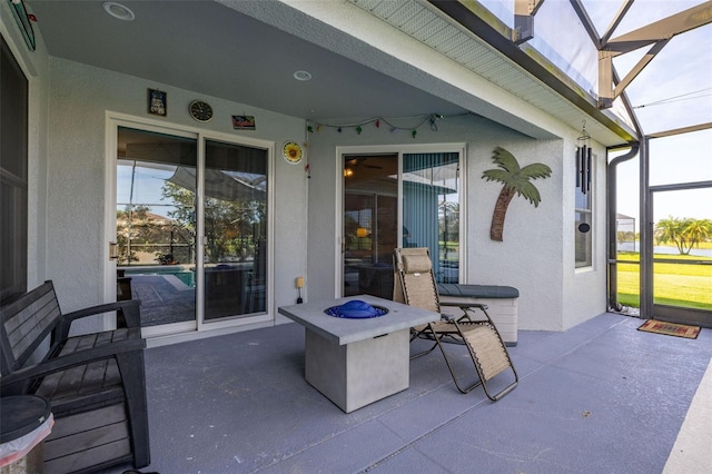 1760 Boat Launch Rd, Kissimmee, FL 34746 - view of patio / terrace with glass enclosure and an outdoor fire pit