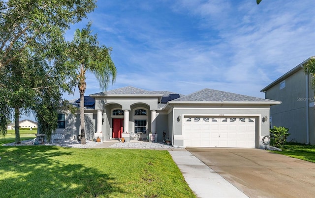 1760 Boat Launch Rd, Kissimmee, FL 34746 - view of front of house with a garage, stucco siding, concrete driveway, a front yard, and roof with shingles