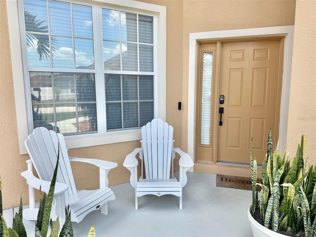 315 Wildflower Rd, Davenport, FL 33837 - doorway to property featuring stucco siding