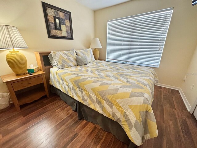 315 Wildflower Rd, Davenport, FL 33837 - bedroom featuring wood finished floors and baseboards