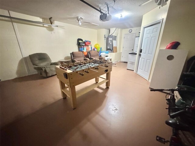 315 Wildflower Rd, Davenport, FL 33837 - game room featuring concrete floors, ceiling fan, and a textured ceiling