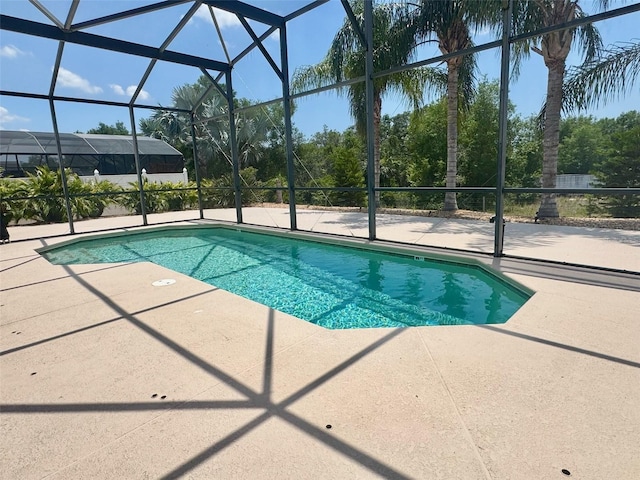 315 Wildflower Rd, Davenport, FL 33837 - outdoor pool with a patio area and glass enclosure