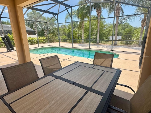 315 Wildflower Rd, Davenport, FL 33837 - swimming pool with a patio area and glass enclosure
