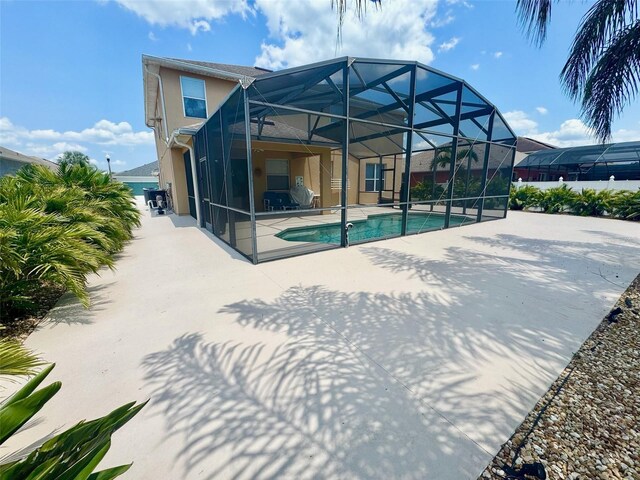315 Wildflower Rd, Davenport, FL 33837 - swimming pool featuring a patio area and a lanai
