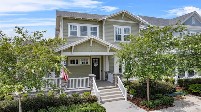 1801 Coastal Ct, Celebration, FL 34747 - craftsman-style house with a porch and a shingled roof