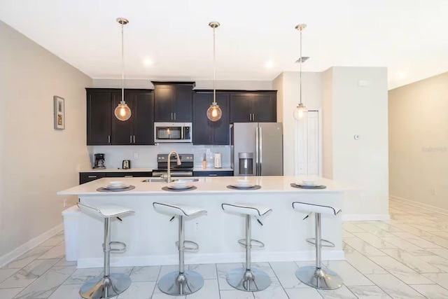 4903 Windermere Ave, Kissimmee, FL 34746 - kitchen with stainless steel appliances, a sink, light marble finish floors, and light countertops