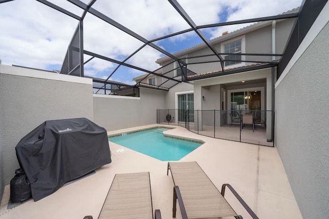 4903 Windermere Ave, Kissimmee, FL 34746 - view of pool featuring a patio, grilling area, and glass enclosure