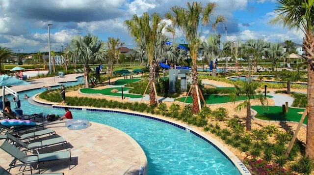 4903 Windermere Ave, Kissimmee, FL 34746 - view of swimming pool with an area to practice putting