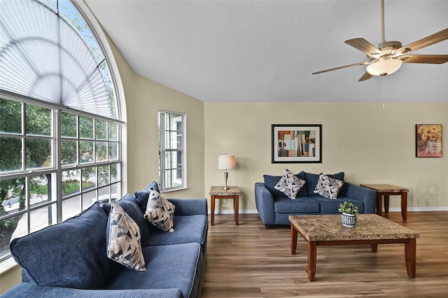 3151 Britannia Blvd Unit C, Kissimmee, FL 34747 - living area with vaulted ceiling, ceiling fan, wood finished floors, and baseboards