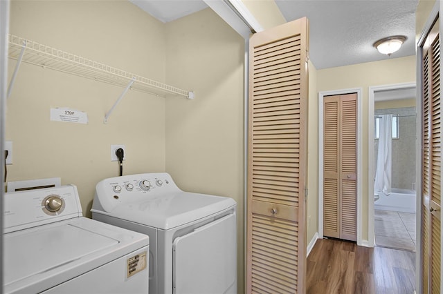 3151 Britannia Blvd Unit C, Kissimmee, FL 34747 - laundry area with separate washer and dryer, baseboards, and wood finished floors