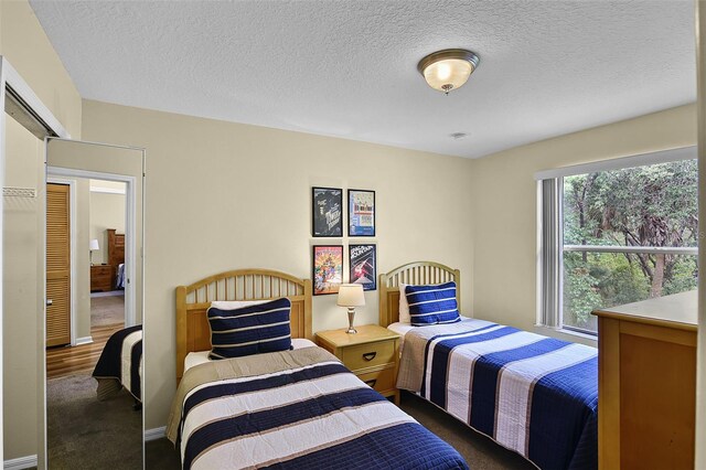 3151 Britannia Blvd Unit C, Kissimmee, FL 34747 - bedroom with carpet floors and a textured ceiling