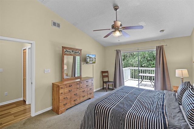 3151 Britannia Blvd Unit C, Kissimmee, FL 34747 - carpeted bedroom featuring access to exterior, lofted ceiling, a textured ceiling, baseboards, and a ceiling fan