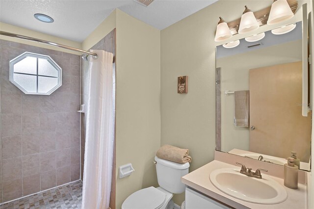 3151 Britannia Blvd Unit C, Kissimmee, FL 34747 - bathroom featuring toilet, vanity, and tiled shower