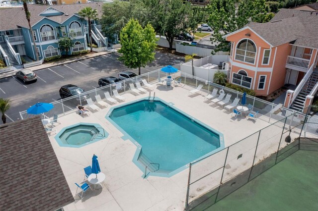 3151 Britannia Blvd Unit C, Kissimmee, FL 34747 - community pool with a hot tub, stairway, and a patio area