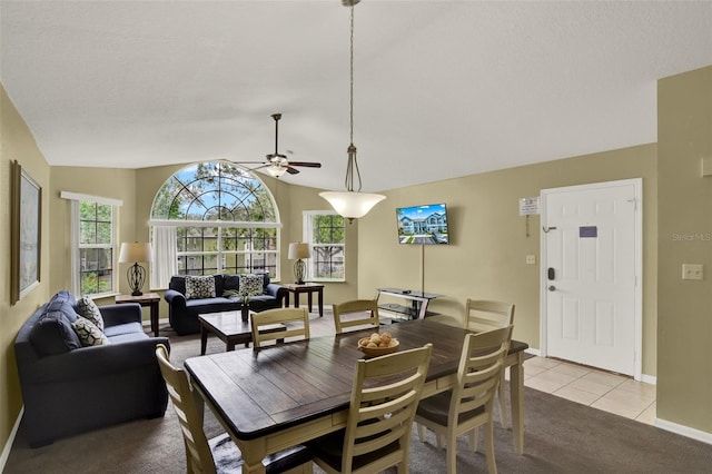 8716 Rain Forest Pl Unit D, Kissimmee, FL 34747 - carpeted dining area featuring ceiling fan, baseboards, vaulted ceiling, and tile patterned floors