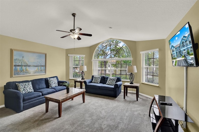 8716 Rain Forest Pl Unit D, Kissimmee, FL 34747 - living area featuring carpet floors, a ceiling fan, lofted ceiling, and baseboards