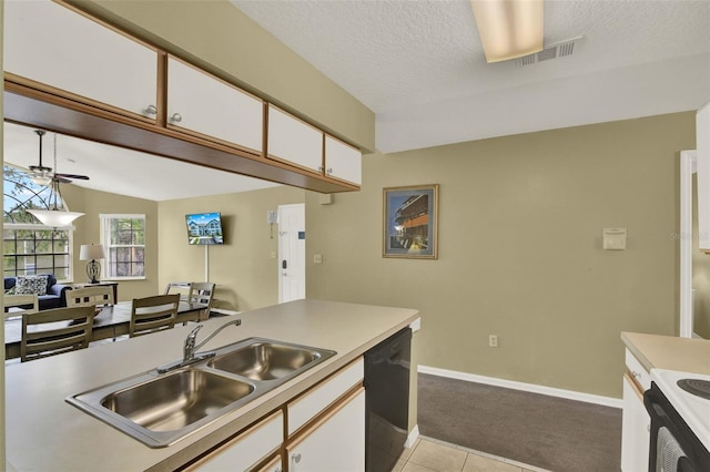 8716 Rain Forest Pl Unit D, Kissimmee, FL 34747 - kitchen featuring dishwasher, a sink, light carpet, a ceiling fan, and white cabinetry